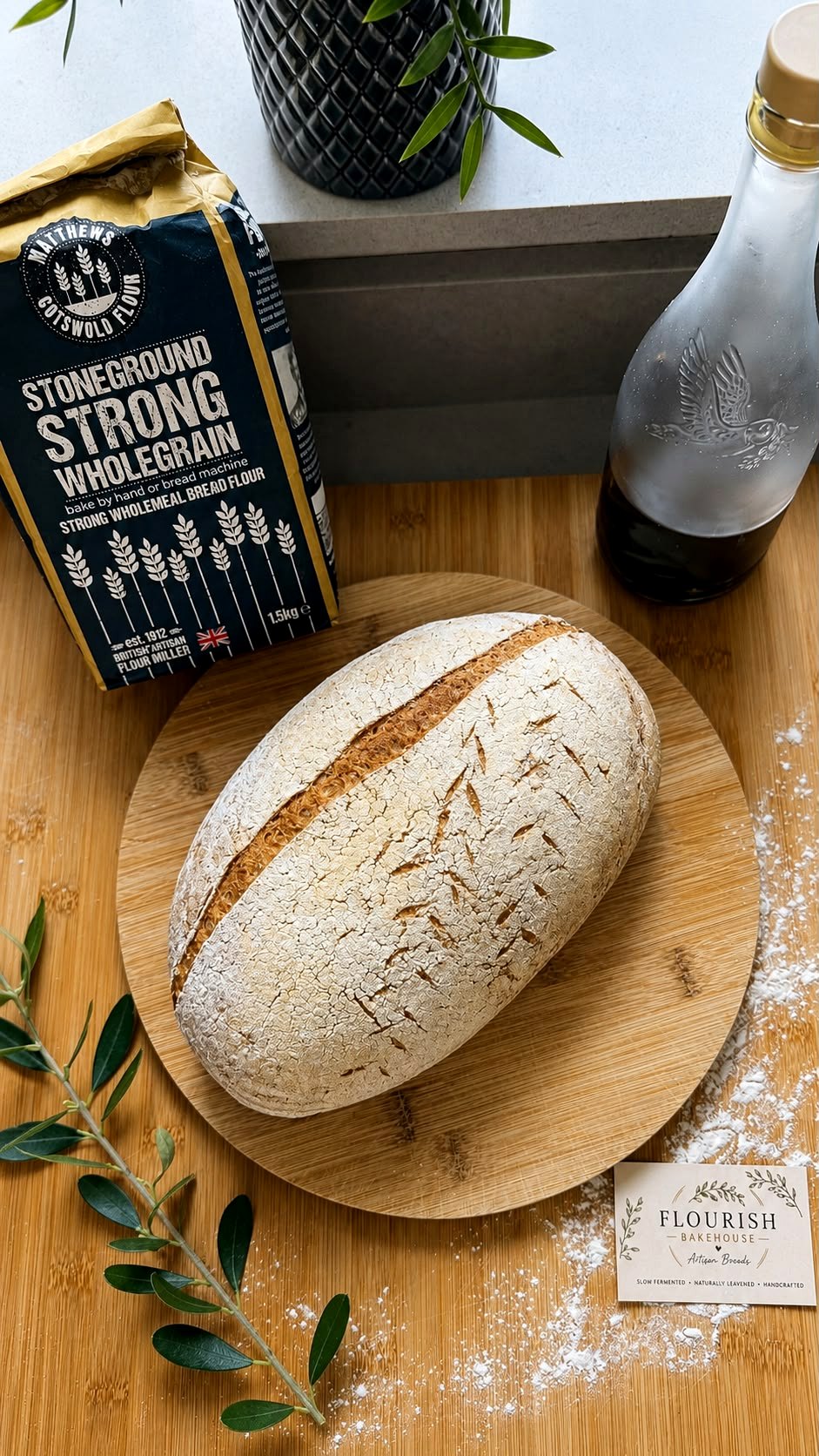 White sourdough styled with flour and Flourish Bakehouse card
